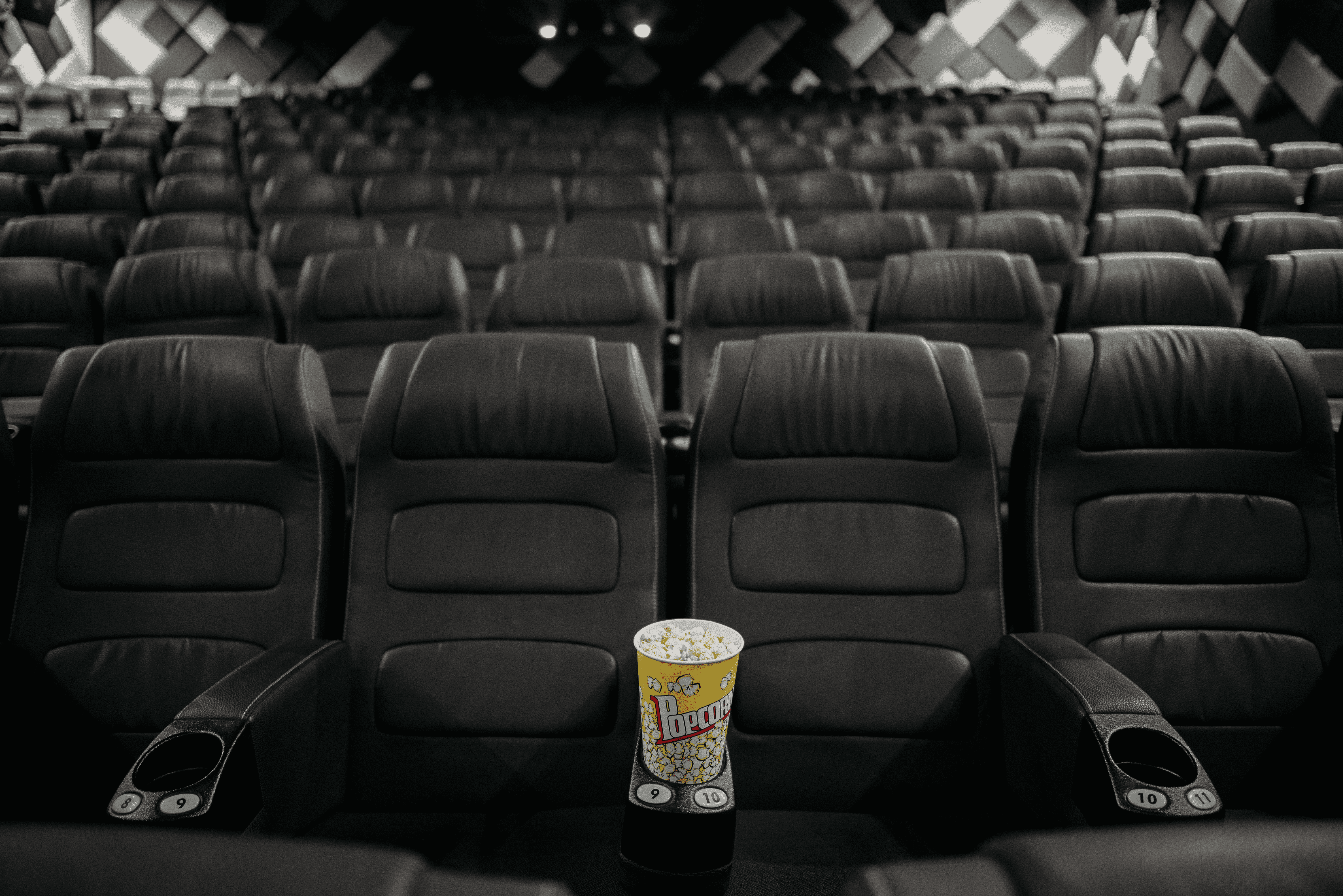 an image showing cinema seats and popcorn